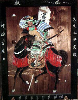 黒い馬に乗った武士が描かれた加藤清正図の写真